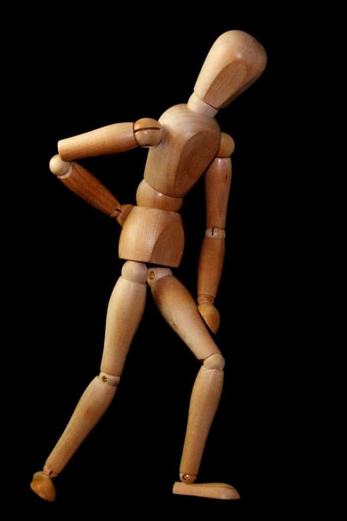 wooden figure showing an example of sciatica pain