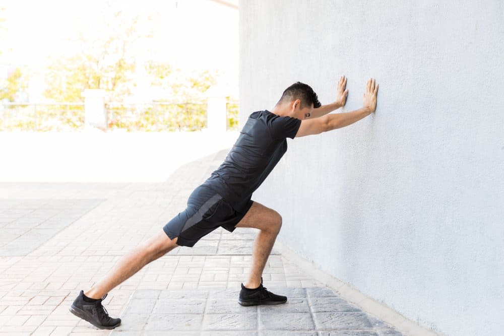 calf stretch for fatigue during and after a hike