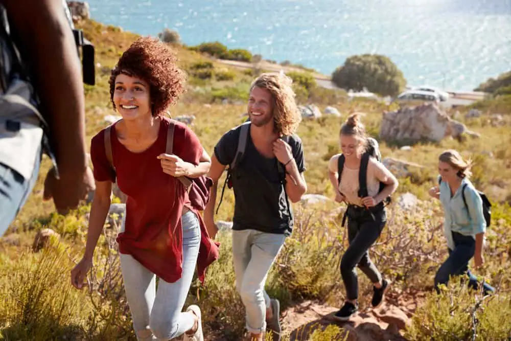 Woman with friends hiking in country side stock photo (154688